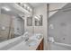 Bathroom with a large vanity, tile floors, walk-in shower and a jetted tub at 2614 Lodi Cir # 106, Kissimmee, FL 34746