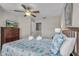 Bedroom with comfortable bed, a ceiling fan, and a dresser with a TV at 2614 Lodi Cir # 106, Kissimmee, FL 34746