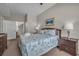 Bedroom features a comfortable bed, stylish decor, and access to a bathroom with a tub at 2614 Lodi Cir # 106, Kissimmee, FL 34746