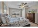 Comfortable bedroom with a large bed, dresser with a TV, and a view of the neighborhood at 2614 Lodi Cir # 106, Kissimmee, FL 34746
