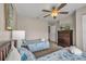 Cozy bedroom with two beds, a ceiling fan, and dresser with television at 2614 Lodi Cir # 106, Kissimmee, FL 34746