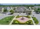 Beautiful clubhouse featuring well-manicured landscaping and a decorative fountain at 2614 Lodi Cir # 106, Kissimmee, FL 34746