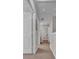 Upstairs hallway with access to multiple rooms, including a bathroom, and carpet flooring at 2614 Lodi Cir # 106, Kissimmee, FL 34746