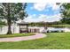 Scenic lake view with gazebo, fountain, and boat launch, surrounded by lush greenery at 2614 Lodi Cir # 106, Kissimmee, FL 34746