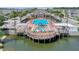 Resort-style pool with spacious deck, lounge chairs, and lakeside gazebo in a beautiful community at 2614 Lodi Cir # 106, Kissimmee, FL 34746