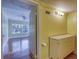 Bathroom vanity with 4-bulb light fixture, tile flooring, and view into the bedroom at 2652 N Woodland Blvd, Deland, FL 32720