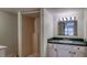 Bathroom with a small shower stall featuring vanity with mirror and lighting at 2652 N Woodland Blvd, Deland, FL 32720