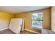 Bedroom featuring a window and two mattresses leaning against the wall on carpeted floors at 2652 N Woodland Blvd, Deland, FL 32720