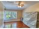 Bedroom featuring hardwood floors, natural lighting, and ceiling fan at 2652 N Woodland Blvd, Deland, FL 32720