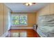 Bedroom featuring hardwood floors, natural lighting, and ceiling fan with lighting at 2652 N Woodland Blvd, Deland, FL 32720