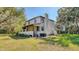 A two-story home with a covered porch and lush green surroundings at 2652 N Woodland Blvd, Deland, FL 32720