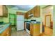 Kitchen featuring vintage wooden cabinets and tiled floor at 2652 N Woodland Blvd, Deland, FL 32720