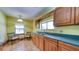Bright eat-in kitchen with tiled floors and wood cabinetry at 2652 N Woodland Blvd, Deland, FL 32720
