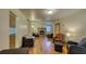 Spacious living room with wood floors, a fireplace, and comfortable seating in an open layout at 2652 N Woodland Blvd, Deland, FL 32720