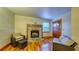 Cozy living room featuring a brick fireplace and hardwood floors at 2652 N Woodland Blvd, Deland, FL 32720