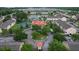 Aerial view of the community, featuring a lake, pool, tennis court and manicured landscape at 2798 Club Cortile Cir # A, Kissimmee, FL 34746