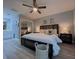 This main bedroom features light gray walls, a ceiling fan, and wood-look floors at 2798 Club Cortile Cir # A, Kissimmee, FL 34746