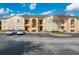 Inviting two-story condo with a well maintained exterior, ample parking, and beautiful landscaping at 2798 Club Cortile Cir # A, Kissimmee, FL 34746
