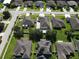 A beautiful aerial view of the neighborhood showcasing the well-maintained lawns and landscaping at 3003 Cobham Rd, Kissimmee, FL 34758