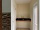 Bright bar area featuring a black countertop and stylish tile backsplash at 3003 Cobham Rd, Kissimmee, FL 34758