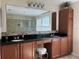 Bathroom features double sinks, vanity, granite countertops and tile backsplash at 3003 Cobham Rd, Kissimmee, FL 34758