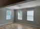 Bright dining room with tile floors, chandelier lighting, and multiple windows at 3003 Cobham Rd, Kissimmee, FL 34758