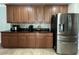 Spacious kitchen with stainless steel appliances, granite countertops, and ample cabinet space at 3003 Cobham Rd, Kissimmee, FL 34758
