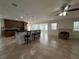 Spacious living area with tile flooring, fireplace, bar seating, and large windows for natural light at 3003 Cobham Rd, Kissimmee, FL 34758