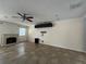 Living room featuring a fireplace, ceiling fan, and tile flooring at 3003 Cobham Rd, Kissimmee, FL 34758