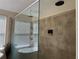 Luxurious shower featuring elegant fixtures and a rain shower head, for a spa-like experience at 3003 Cobham Rd, Kissimmee, FL 34758