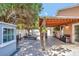 Paver patio with outdoor kitchen, entertainment, and lounge seating offer relaxation at 3134 Koval Ct, Orlando, FL 32837