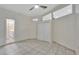 Large bedroom with tile flooring, double closets, and updated lighting at 3134 Koval Ct, Orlando, FL 32837