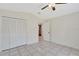 Bright bedroom with tile flooring, a ceiling fan, and a large closet at 3134 Koval Ct, Orlando, FL 32837