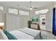 Comfortable bedroom featuring tile floors, a ceiling fan and bright natural light at 3134 Koval Ct, Orlando, FL 32837