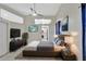 Modern bedroom featuring tile floors, a ceiling fan and access to the kitchen at 3134 Koval Ct, Orlando, FL 32837