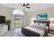 Inviting bedroom featuring tile floors, a ceiling fan and bright natural light at 3134 Koval Ct, Orlando, FL 32837