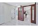 Entryway with tile flooring featuring sliding doors offering views of the living room and kitchen at 3134 Koval Ct, Orlando, FL 32837