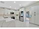 Bright kitchen with stainless steel appliances, white cabinets, and an adjacent door to the backyard at 3134 Koval Ct, Orlando, FL 32837