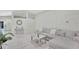 Living room showcasing tile floors, a modern gray sofa, and decor at 3134 Koval Ct, Orlando, FL 32837