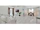 Open floor plan with living room, dining area with modern lighting, and tiled floors creating a welcoming space at 3134 Koval Ct, Orlando, FL 32837