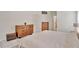 Bedroom with wood furniture, tiled floors, and ample closet space offering comfort and functionality at 3134 Koval Ct, Orlando, FL 32837