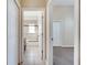 Hallway bathroom featuring a tub-shower combination, tiled walls, and vanity, conveniently located near bedrooms at 3211 Countryside View Dr, St Cloud, FL 34772