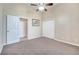 Cozy bedroom with carpet flooring and a ceiling fan, perfect for a relaxing retreat at 3211 Countryside View Dr, St Cloud, FL 34772