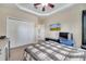 Bedroom featuring carpet, ceiling fan, white closet doors, and light-colored walls at 3211 Countryside View Dr, St Cloud, FL 34772