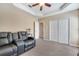 Relaxing bedroom with plush carpeting, tray ceiling, and ample closet space at 3211 Countryside View Dr, St Cloud, FL 34772