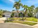 Charming single-Gathering home with mature landscaping and palm trees on a sunny day at 3211 Countryside View Dr, St Cloud, FL 34772