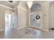 Warm foyer with high ceilings and decorative tile, offering access to other rooms in the home at 3211 Countryside View Dr, St Cloud, FL 34772