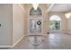 Inviting foyer with decorative tile, high ceilings, and elegant chandeliers create a grand entrance at 3211 Countryside View Dr, St Cloud, FL 34772