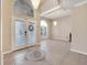 Elegant foyer with decorative tile inlay, chandelier, and arched window features ample natural light at 3211 Countryside View Dr, St Cloud, FL 34772