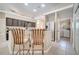 Kitchen featuring stainless steel appliances, granite countertops, and breakfast bar seating at 3211 Countryside View Dr, St Cloud, FL 34772